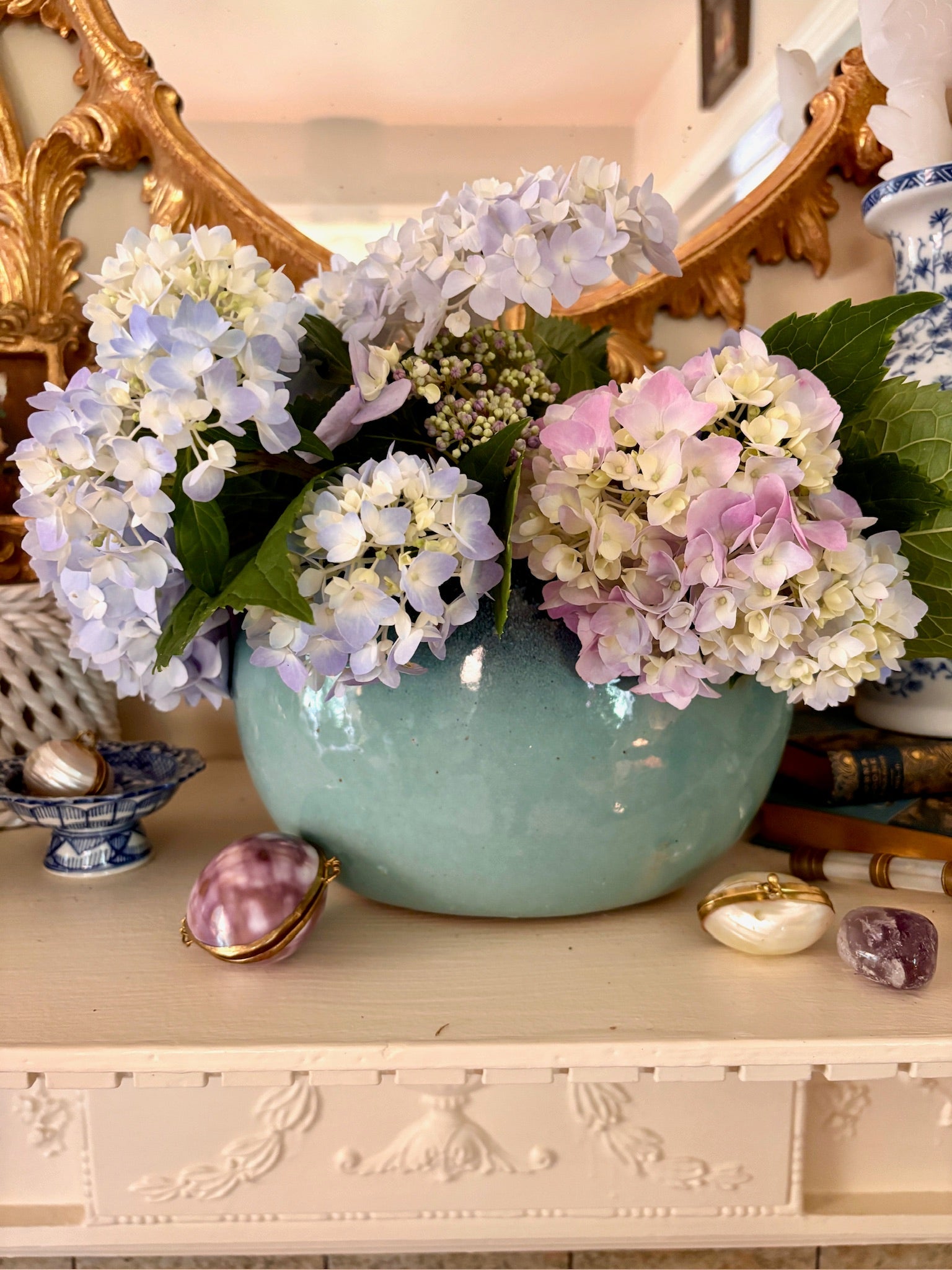 Round ceramic vase with a wide mouth and a glossy teal-green glaze that varies in tone.