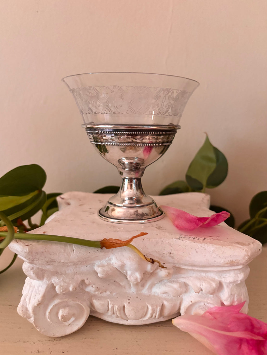 Front view of sterling silver and etched glass compote showing beaded collar, pierced silver band, and pedestal foot.
