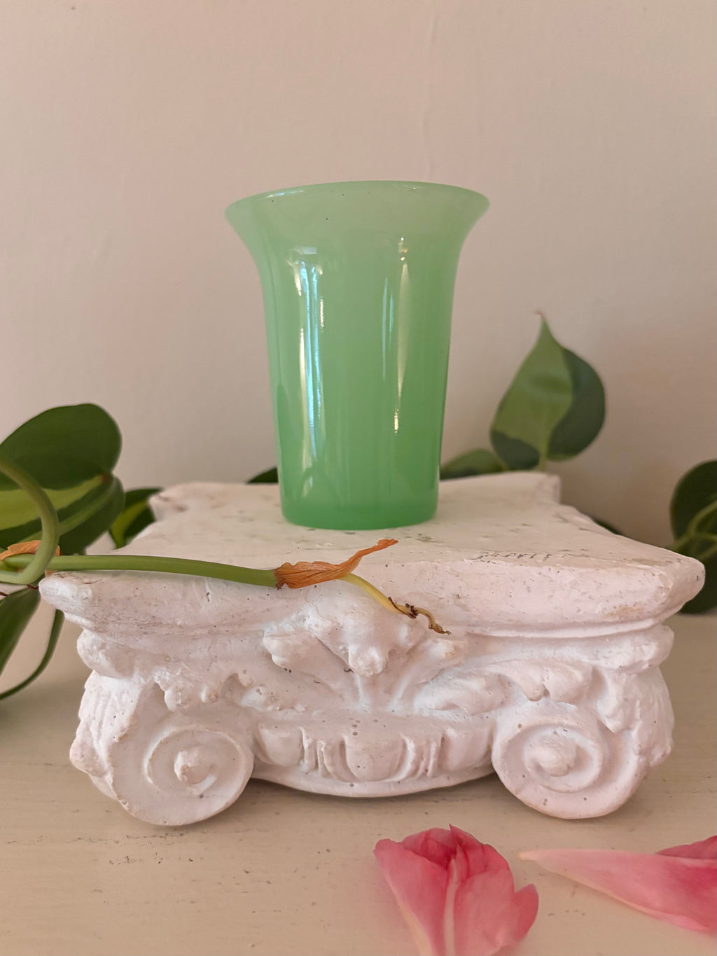 Small opaque mint green jadeite glass tumbler with tapered cylindrical body and gently flared rim.