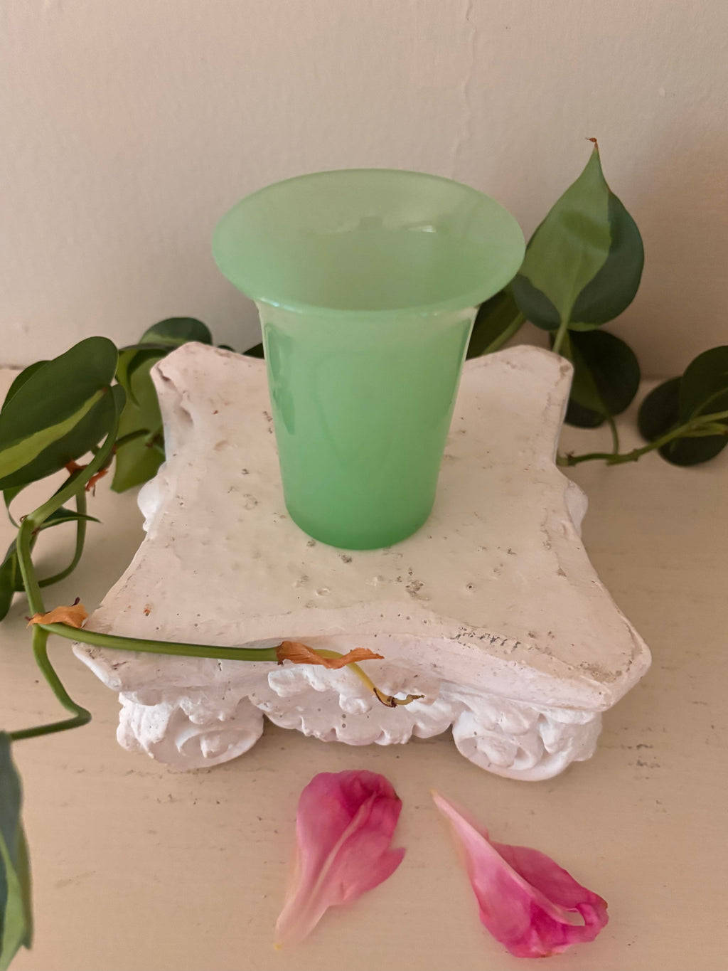 Small opaque mint green jadeite glass tumbler with tapered cylindrical body and gently flared rim.