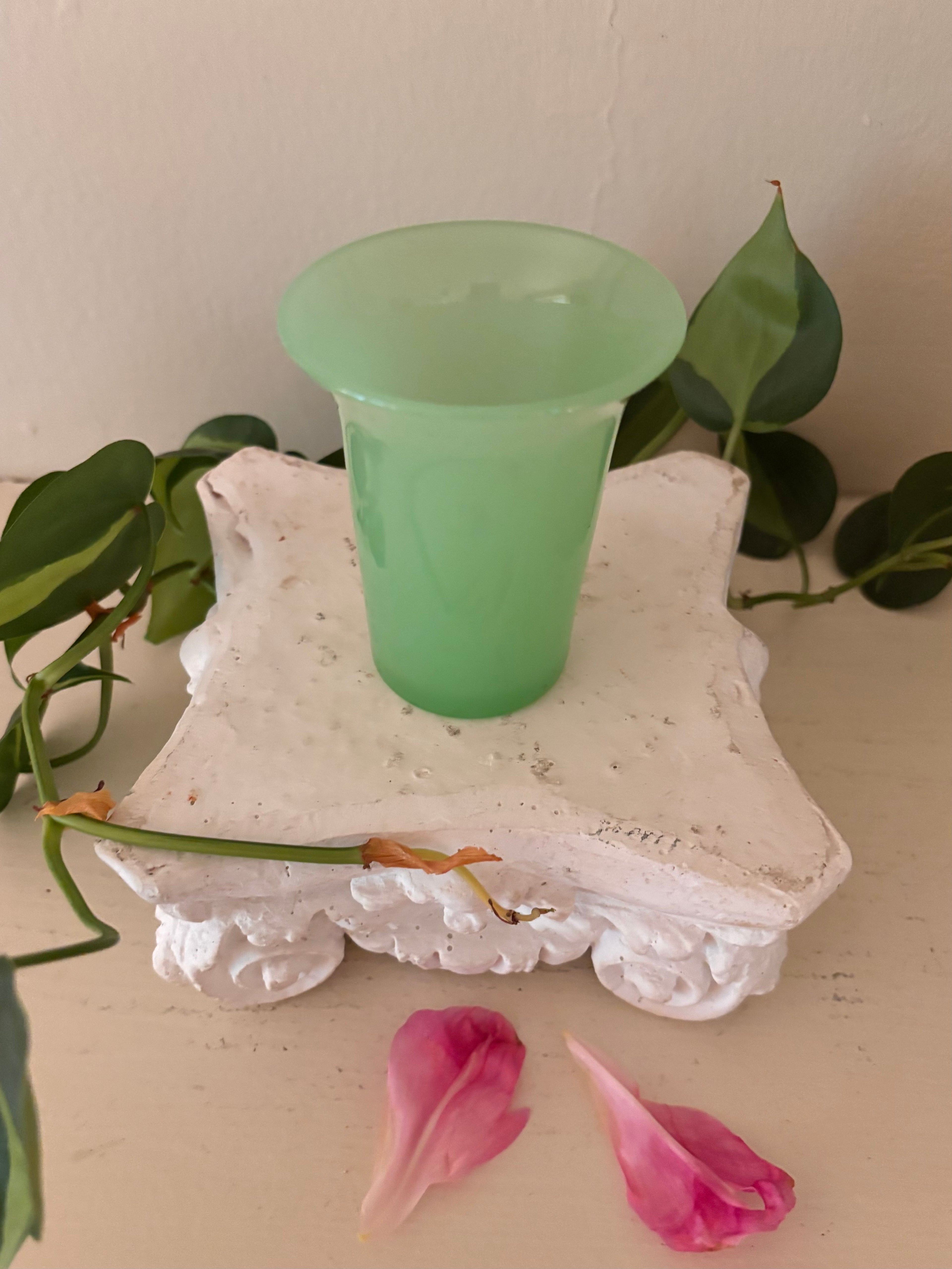 Small opaque mint green jadeite glass tumbler with tapered cylindrical body and gently flared rim.