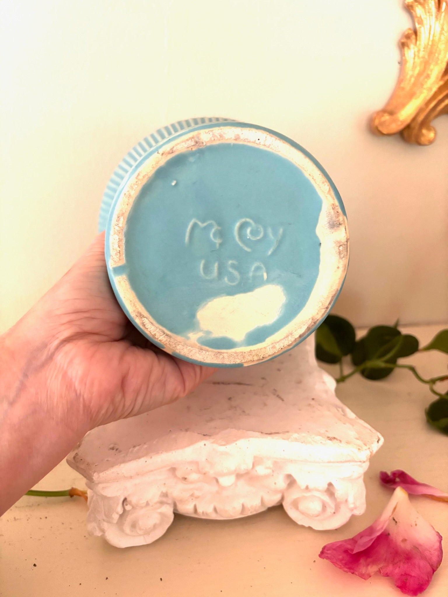 Underside of teal McCoy USA pedestal compote showing maker's stamp and unglazed base rim.