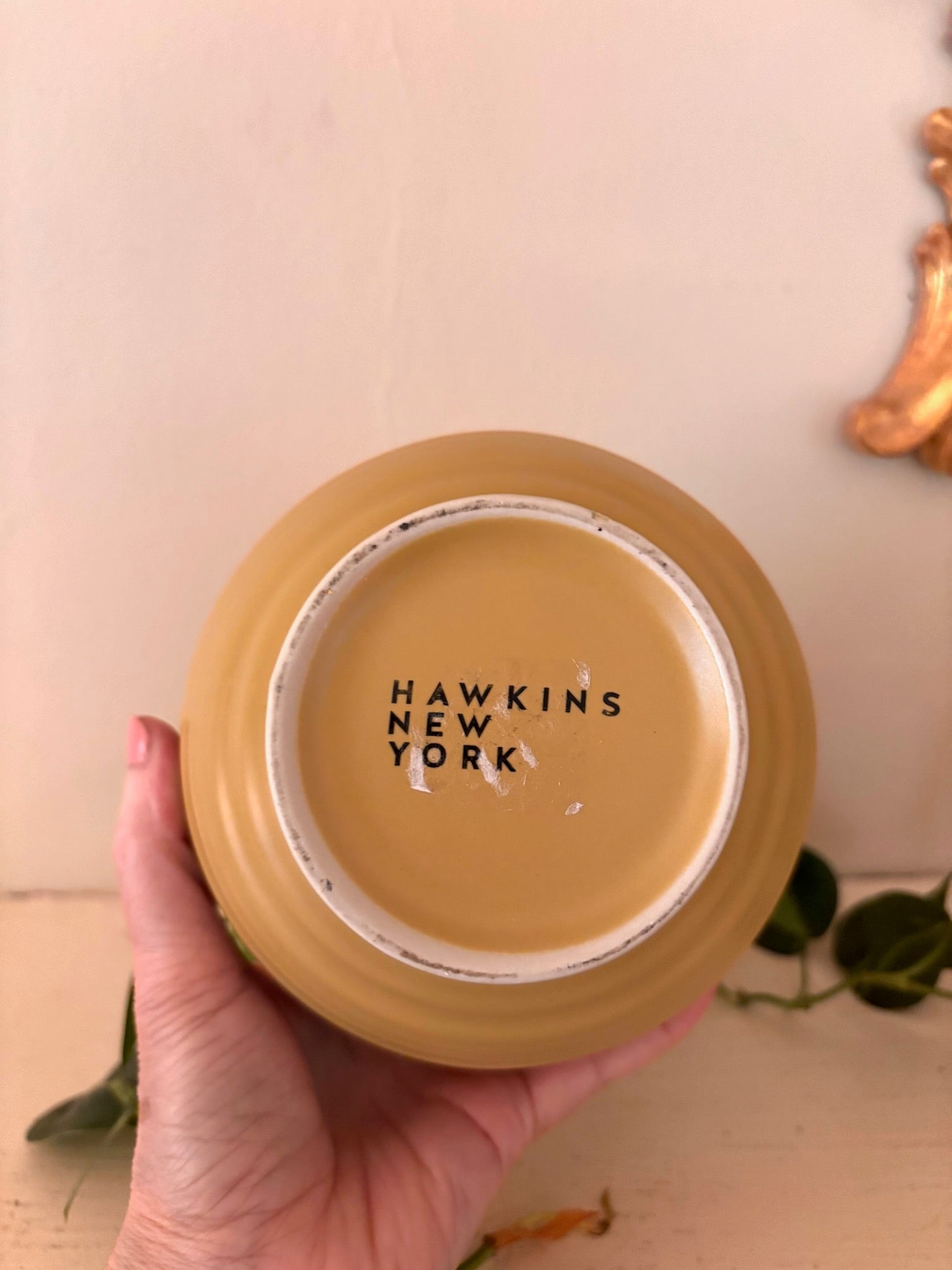 Base of peach ribbed ceramic vase showing Hawkins New York maker's mark.