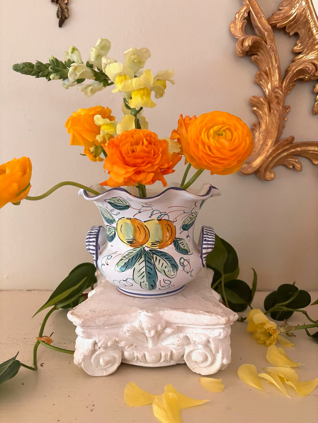 Opposite side of Italian Cottura cachepot showing hand-painted orange citrus motif with teal leaves.