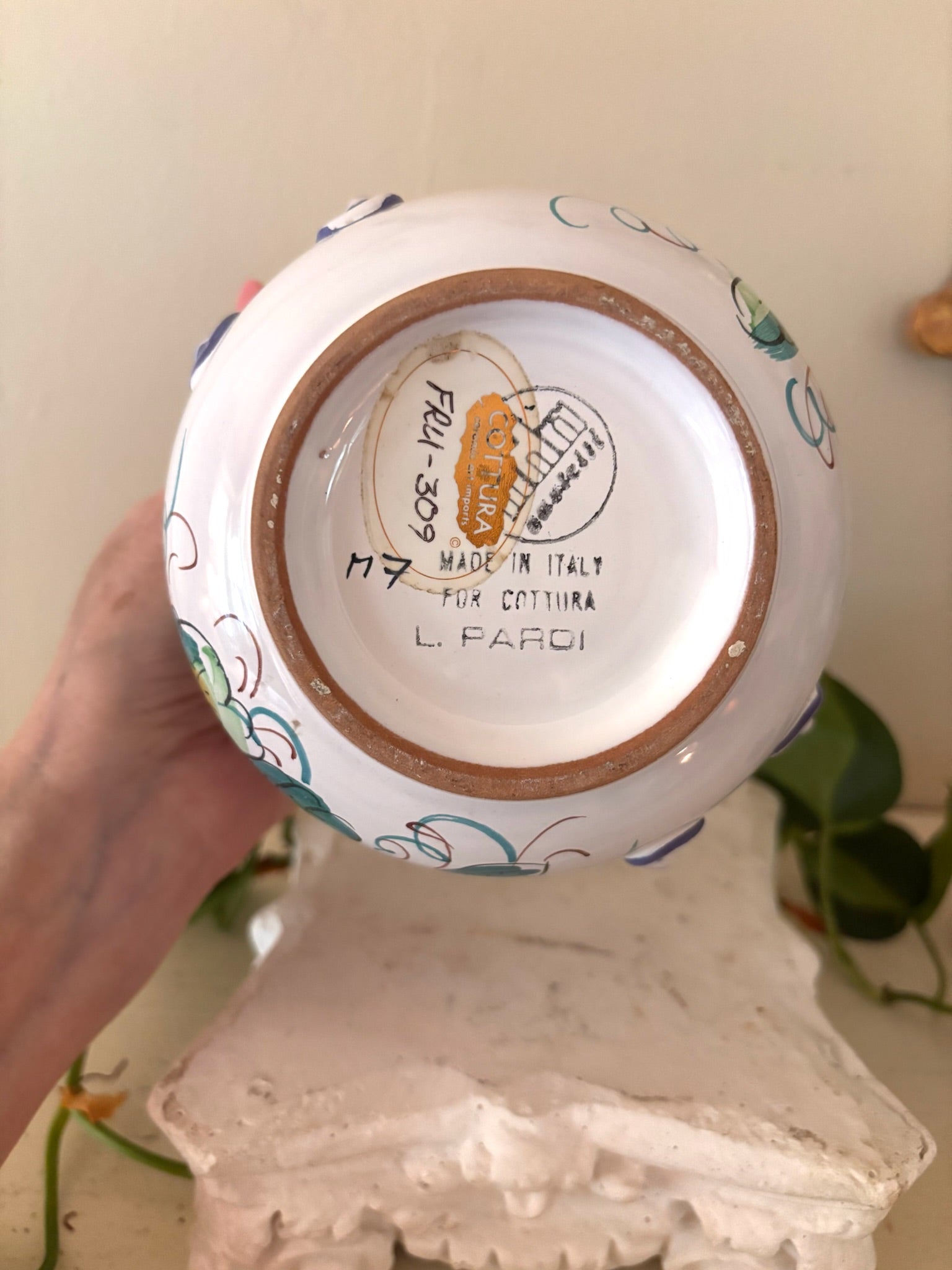 Base of Italian ceramic cachepot showing Cottura import sticker and L. Pardi maker's mark.