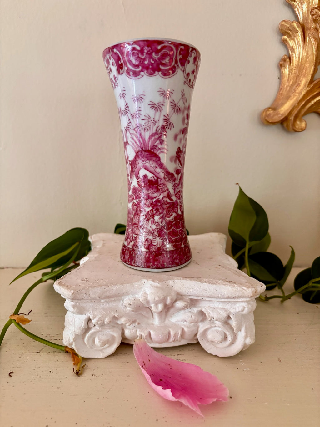 Full view of pink and white European porcelain trumpet vase showing chinoiserie figure scene.