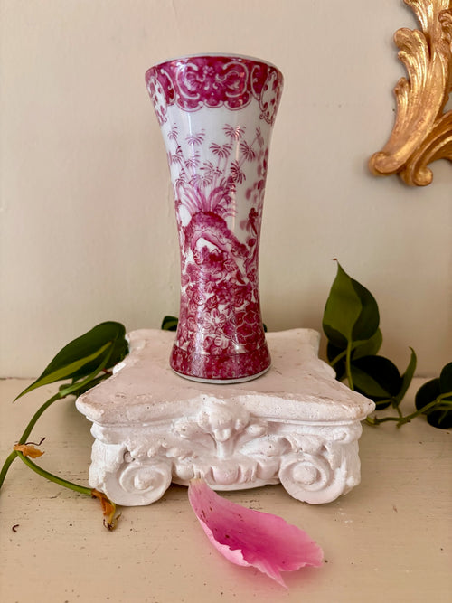 Full view of pink and white European porcelain trumpet vase showing chinoiserie figure scene.