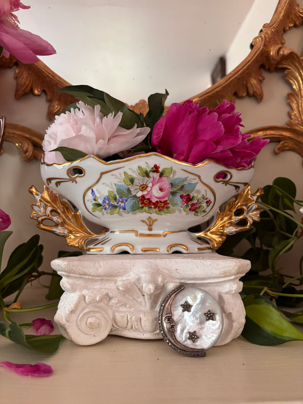 White porcelain centerpiece bowl with hand-painted floral bouquet cartouche and gilt acanthus handles.