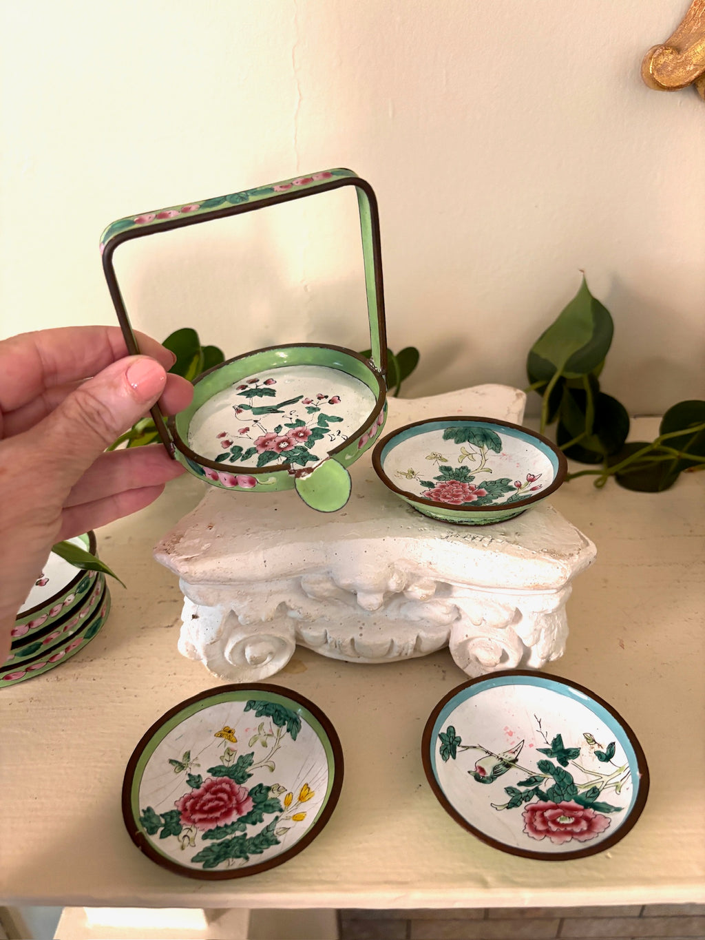 Green enamel handled basket with hand-painted Canton enamel dishes showing birds, peonies, and butterflies.