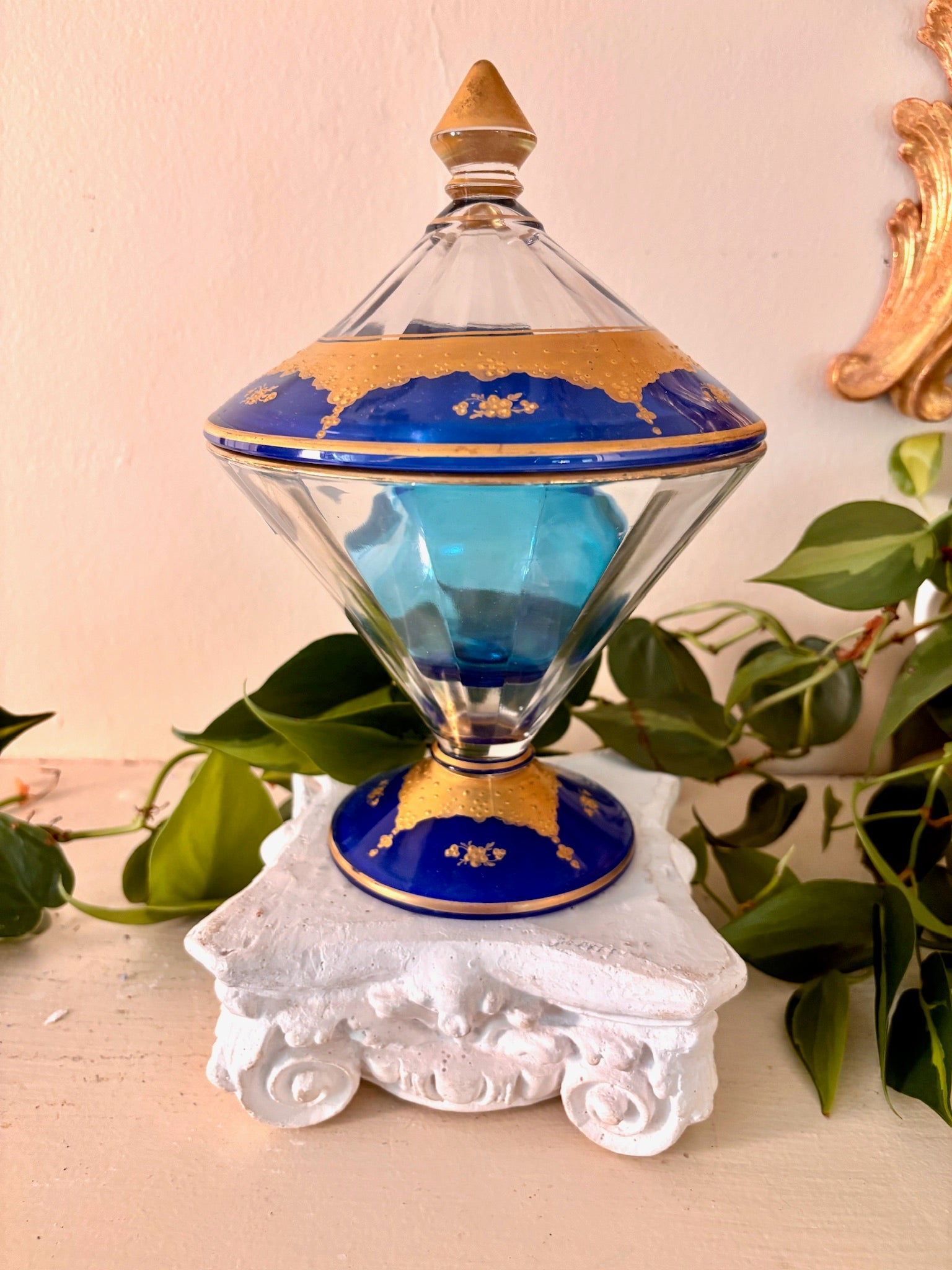 glass lidded compote with cobalt blue interior and gold gilt floral banding.