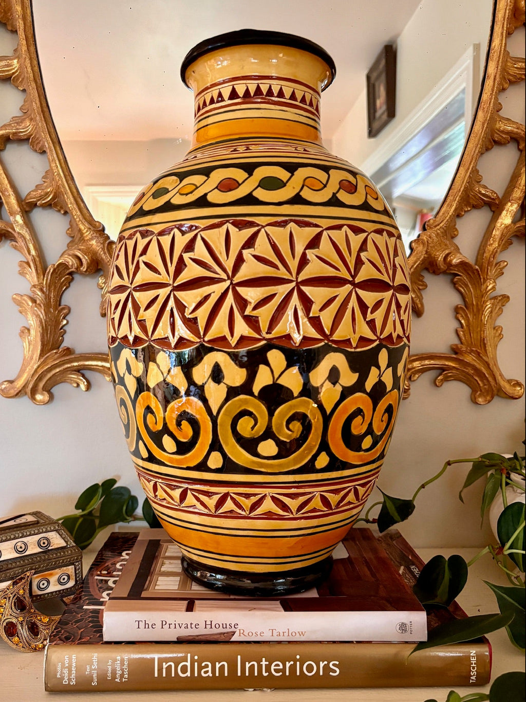 Large Moroccan Safi vase carved with rosettes and scrollwork, glazed in ocher and oxblood.