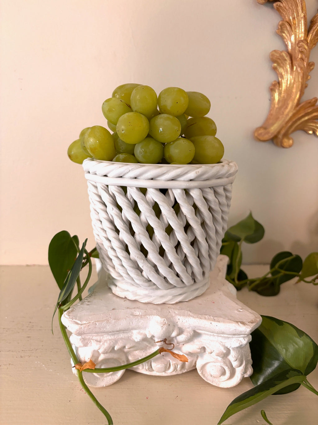 White glazed ceramic basket with twisted rope lattice sides and a rolled rope rim.